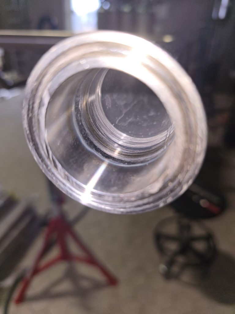 RAM project: Close view through a stainless steel pipe end showing the internal joint at the brewery project