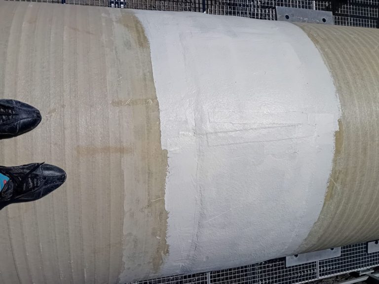 RAM project: Completed laminate band around a composite pipe joint at the Fish Flow Project