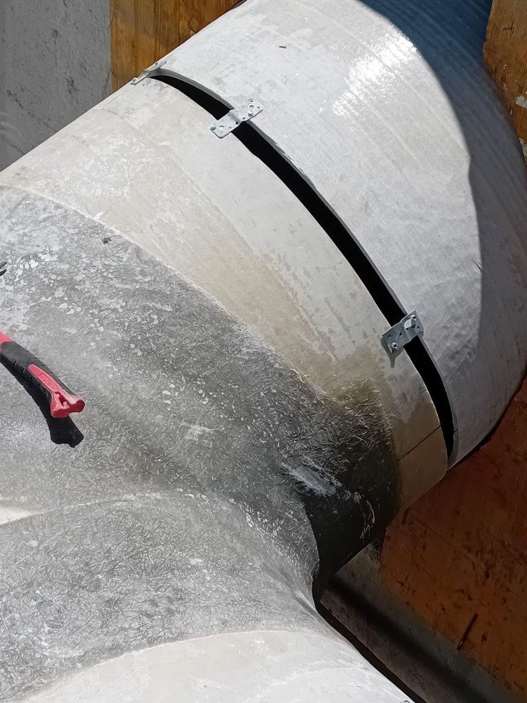 RAM project: Fibreglass laminate and joint preparation on a composite pipe at Lesu Dam