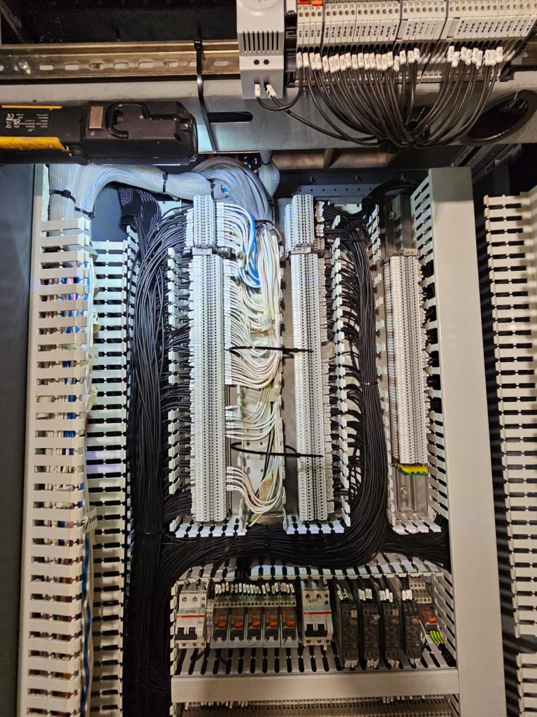 RAM project: Labelled terminal blocks and cable routing inside a marine electrical cabinet
