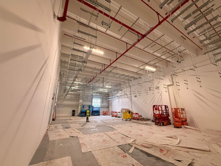 RAM project: Long view of overhead containment supports and protected floor in Frankfurt