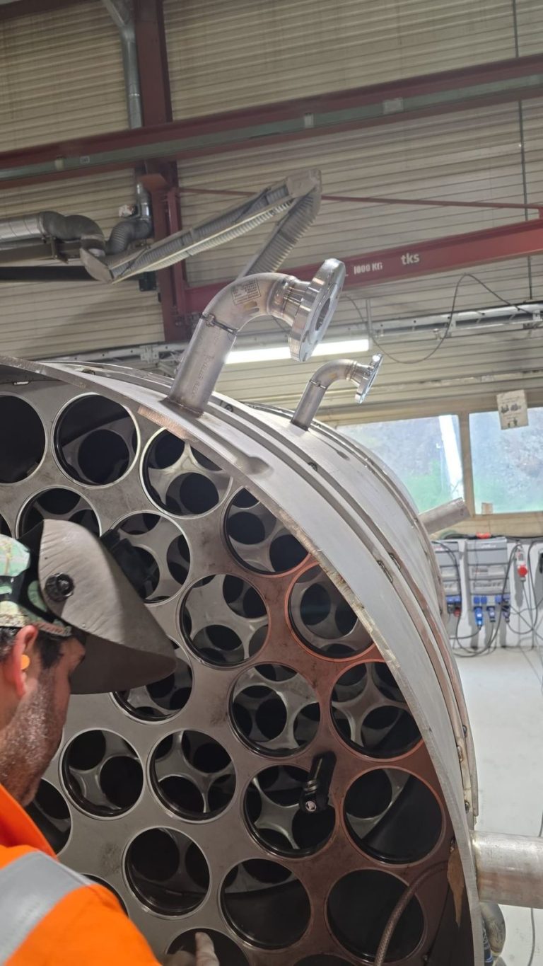 RAM project: Open end of a desalination tank with internal tube supports and flanged connections
