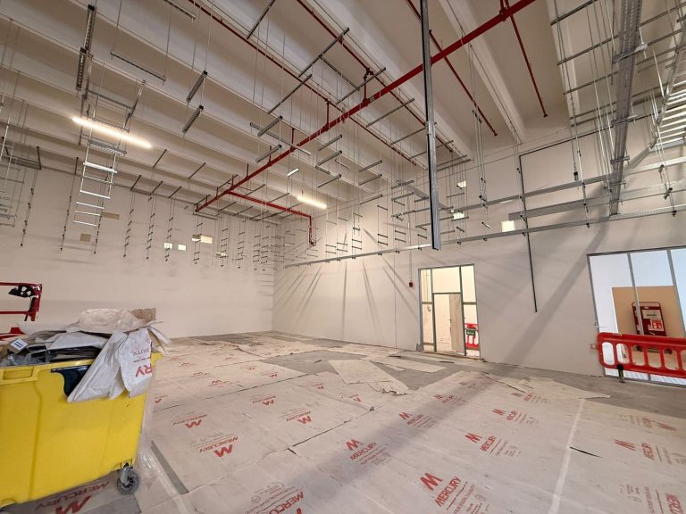 RAM project: Overhead support hangers and cable tray runs above the data center work area
