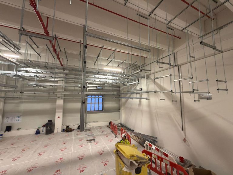 RAM project: Rows of multi level support brackets suspended across the data center hall