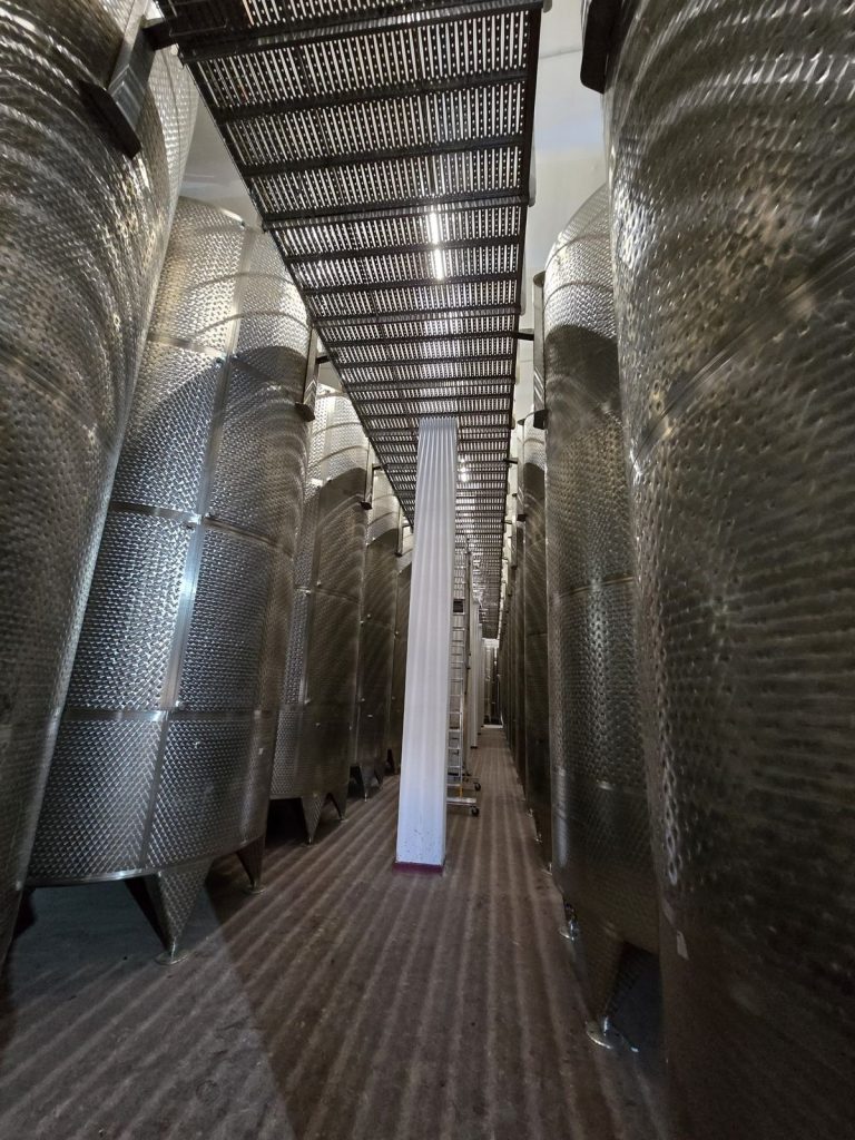 RAM project: Stainless steel storage tanks beneath an elevated access walkway