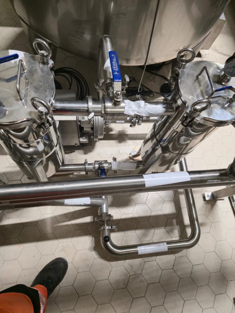RAM project: Top view of twin stainless steel filter housings and isolation valves at the brewery