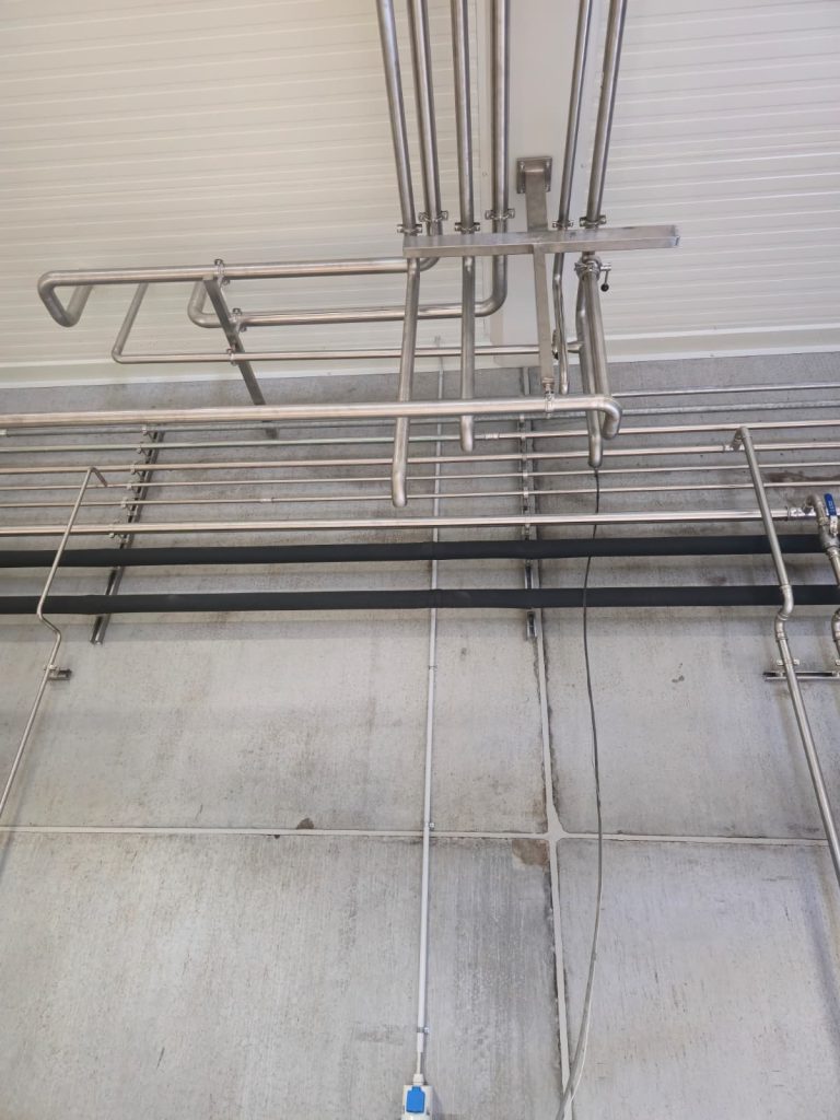RAM project: Wall and ceiling mounted stainless steel process pipework at a Danish brewery