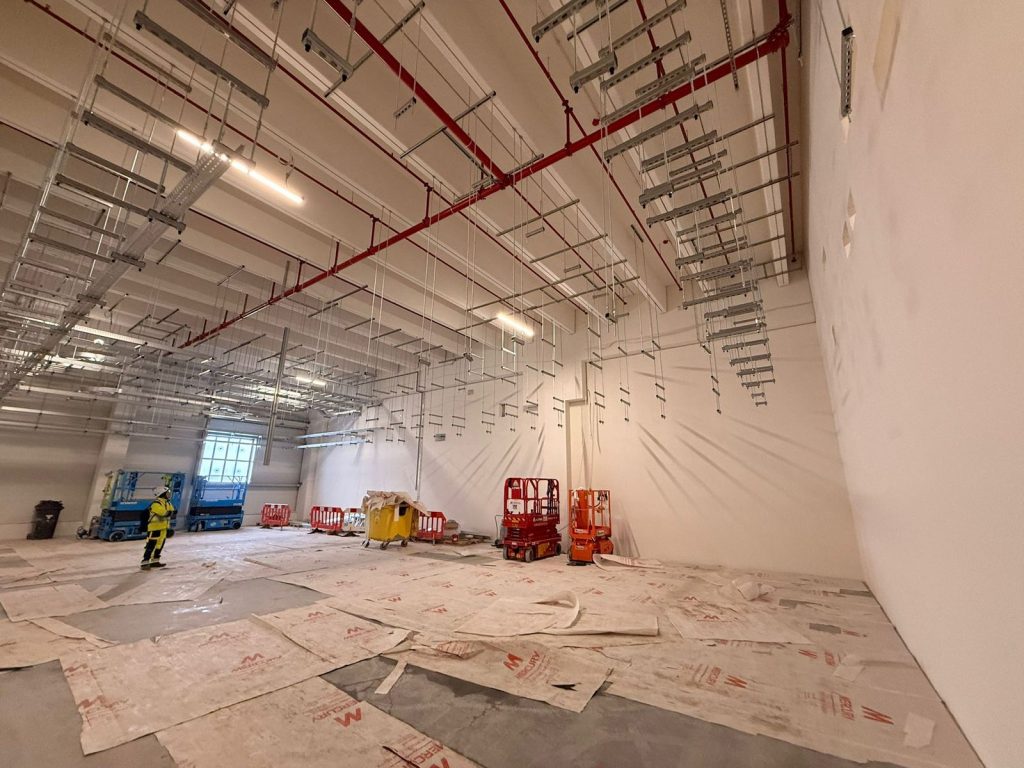 RAM project: Wide view of suspended cable tray supports across the Frankfurt data center hall