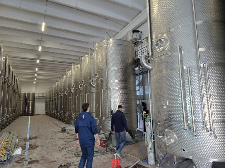 RAM project: Winery storage tank hall with site personnel and installation materials