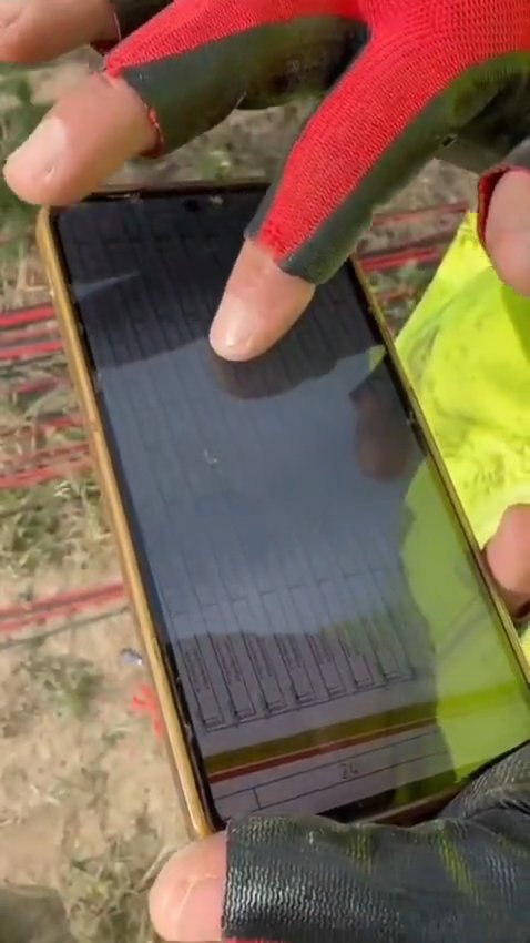 Photovoltaic module being handled by a RAM crew member on a solar construction site